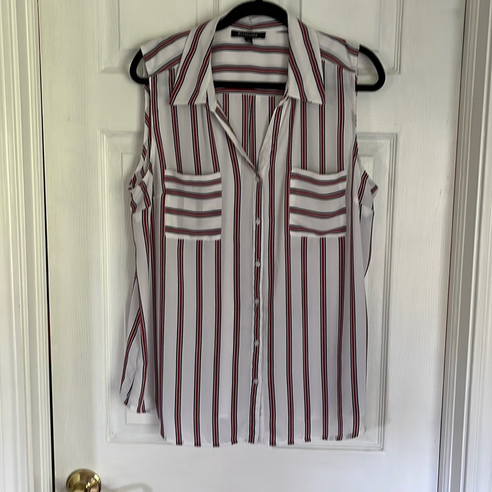 Sleeveless blouse with red white and blue stripes. Pockets on front.